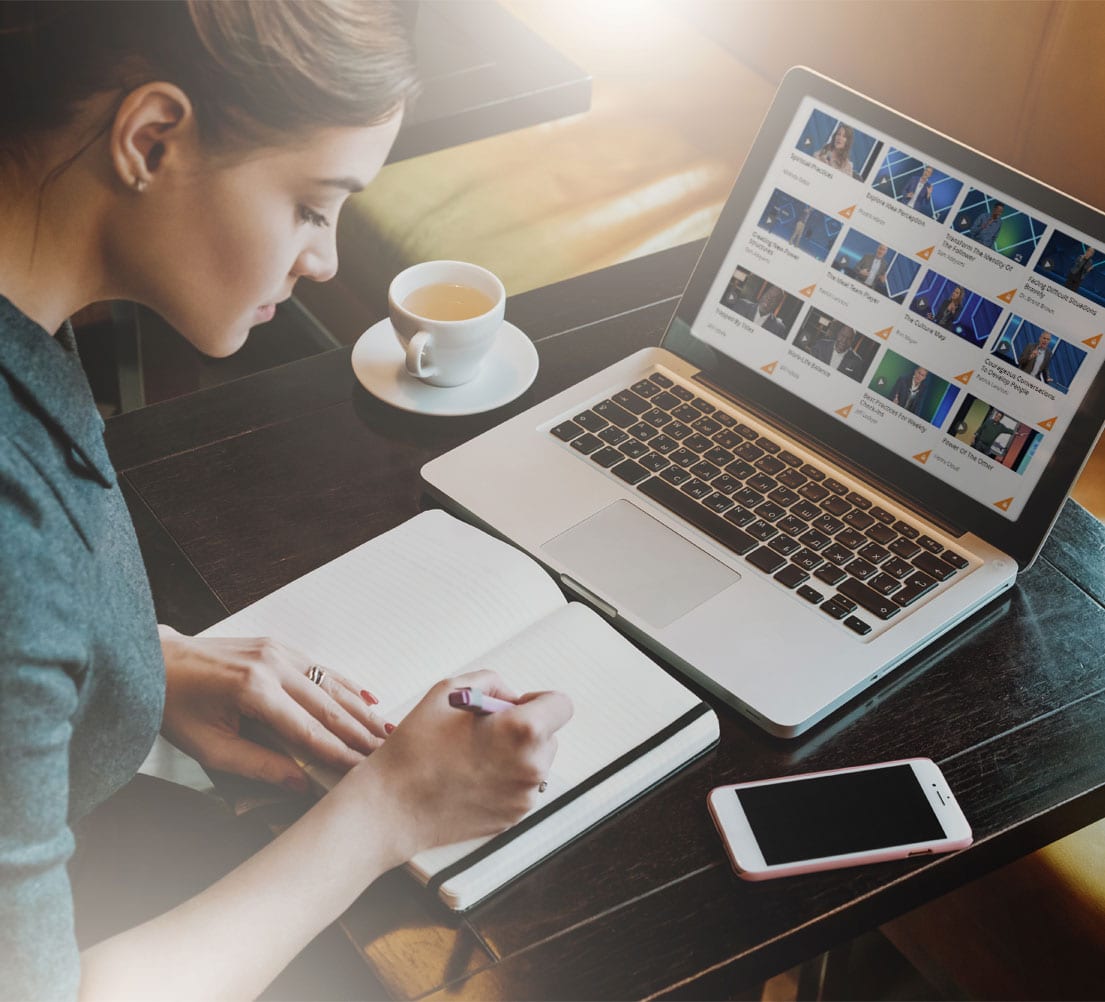 Woman using laptop watching GLS Live Stream on demand