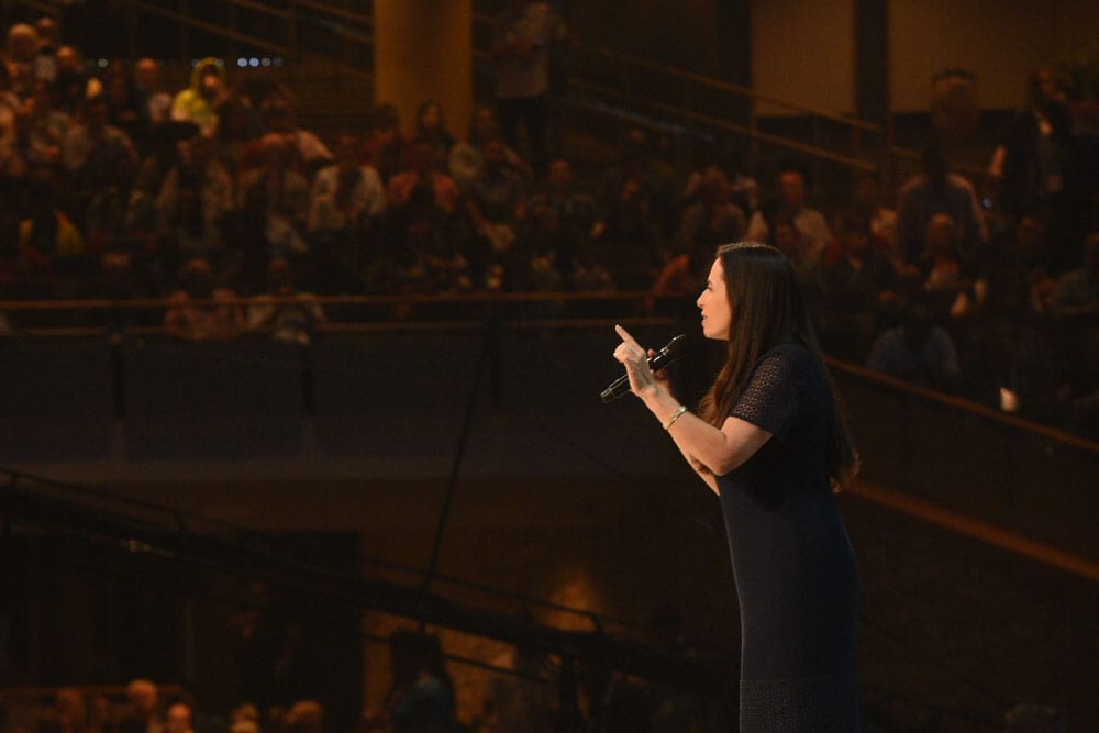 Juliet Funt speaking from the stage at The Global Leadership Summit 2018.