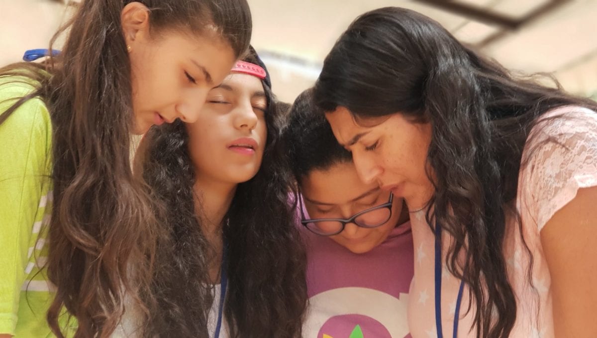 Four women praying