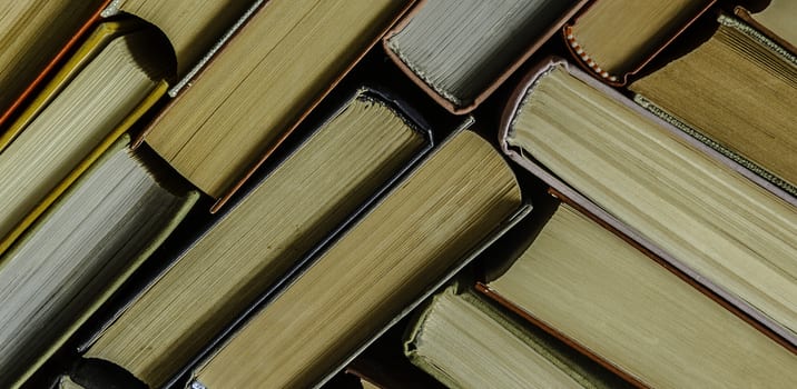 a stack of colorful books in a library