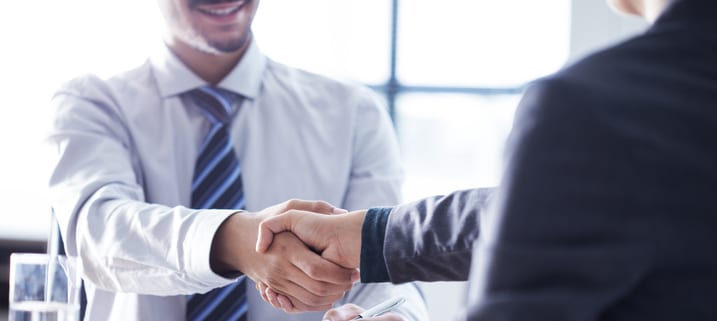 Business handshake in the office