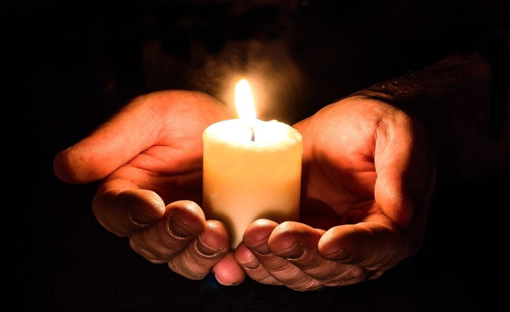 Candle in hands