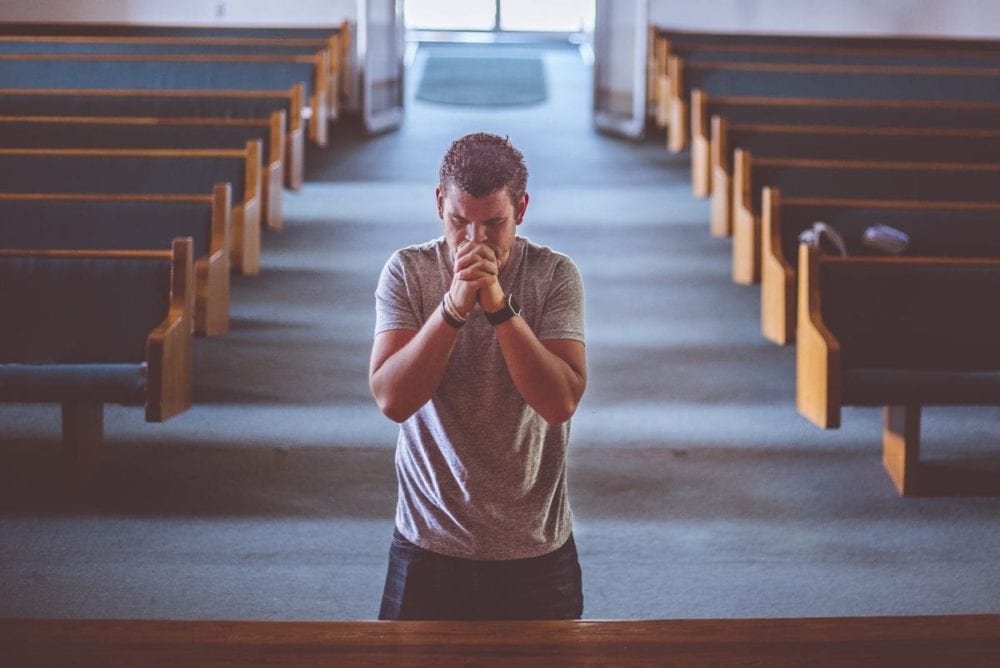 Man praying in a church