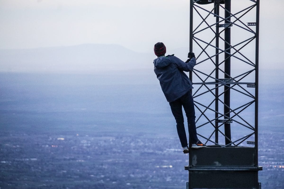 Man on tower in city